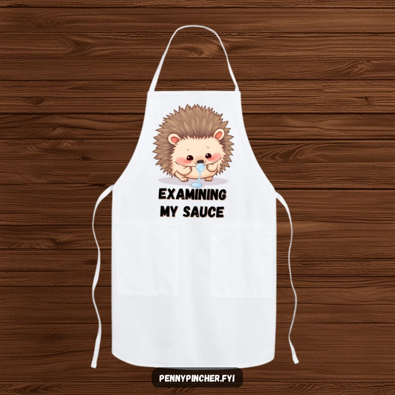 Funny apron showing a curious hedgehog carefully examining a single dewdrop, perfect for a mindful cook.