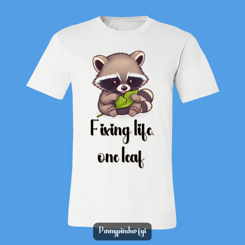 Funny Raccoon Mending T-Shirt: Cute raccoon fixing a leaf, a funny gift for detail-oriented people.
