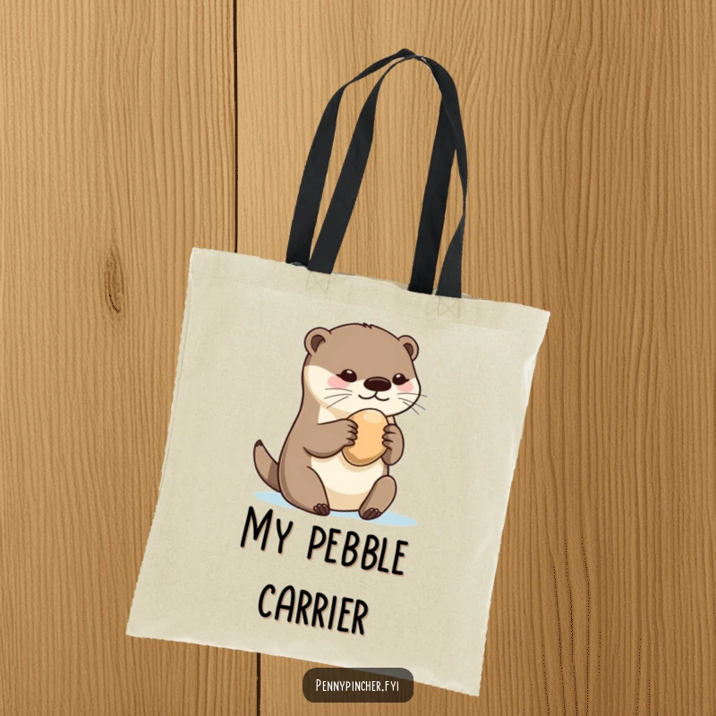 Funny otter tote bag, showcasing a playful otter protectively holding a single, shiny pebble, a symbol of cherished finds.